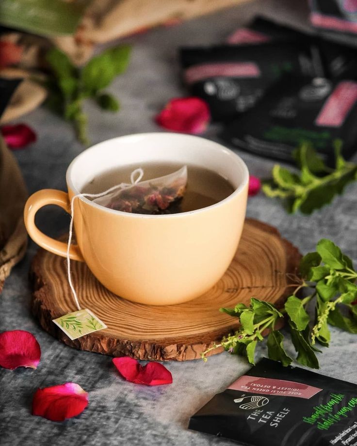 A warm cup of Zafarghandi tea with rose petals and fresh herbs